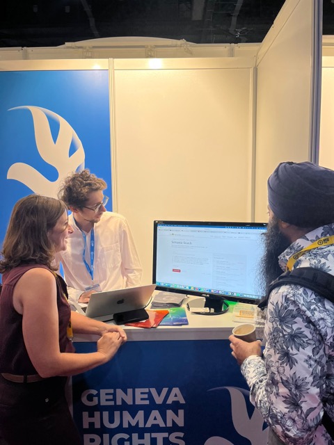 Łukasz Szoszkiewicz at the Geneva Human Rights Hub booth, AI for Good 2026, Geneva